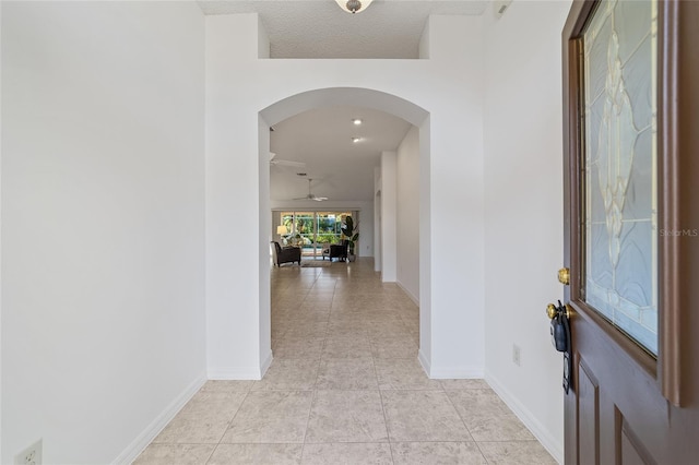 hallway featuring light tile patterned floors