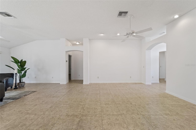 unfurnished living room featuring lofted ceiling, a textured ceiling, and ceiling fan