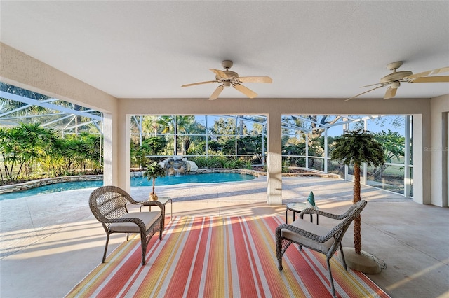 view of patio with a lanai and ceiling fan