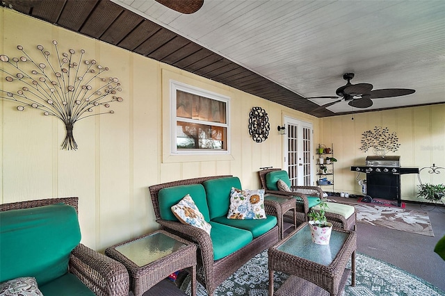 view of patio / terrace with an outdoor living space, ceiling fan, and french doors