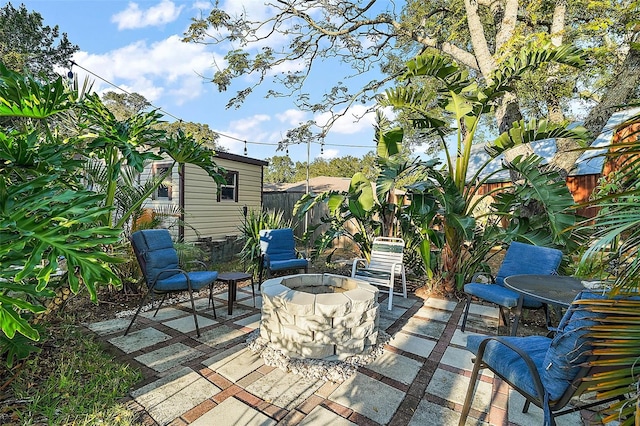 view of patio / terrace featuring an outdoor fire pit