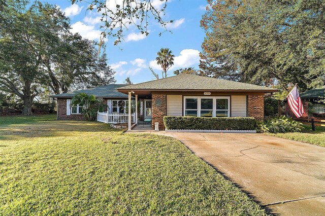 view of front of property with a front lawn and a porch