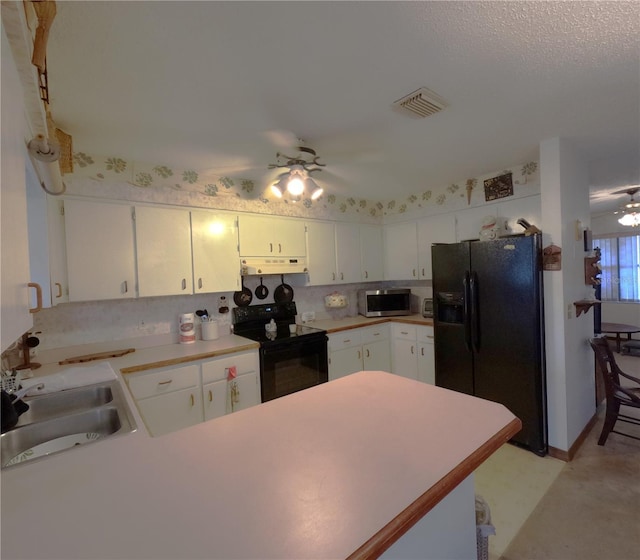 kitchen with black appliances, ceiling fan, white cabinets, and sink