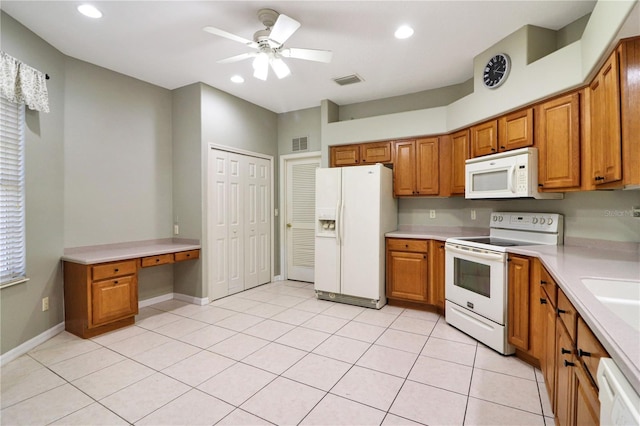 kitchen featuring light tile patterned floors, white appliances, and ceiling fan