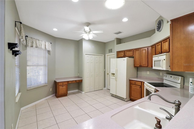 kitchen with ceiling fan, white appliances, sink, and light tile patterned floors