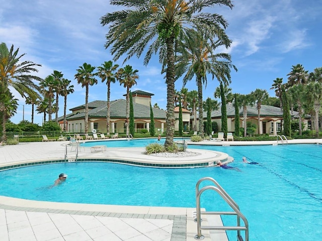 view of swimming pool featuring a patio area