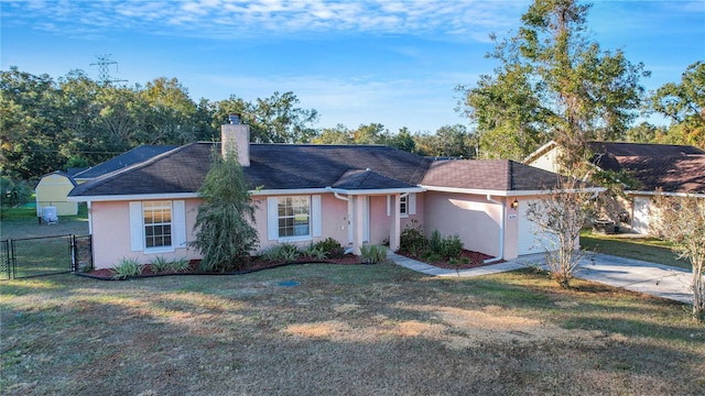 single story home featuring a garage and a front yard