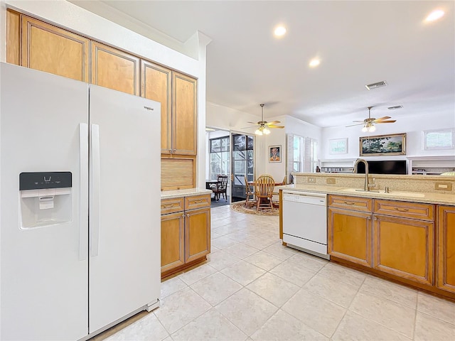 kitchen featuring light tile patterned floors, white appliances, and ceiling fan