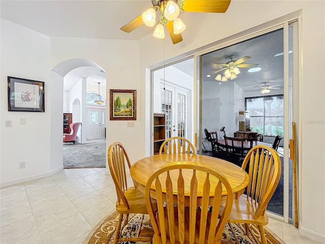 dining room featuring french doors and light tile patterned floors