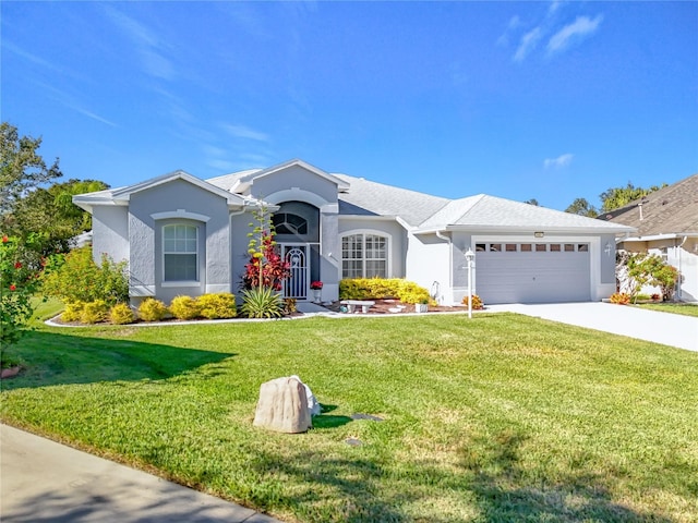 single story home featuring concrete driveway, an attached garage, a front yard, and stucco siding