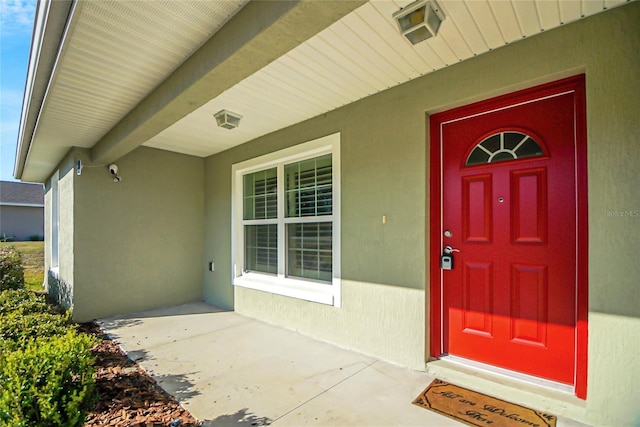 entrance to property featuring a porch