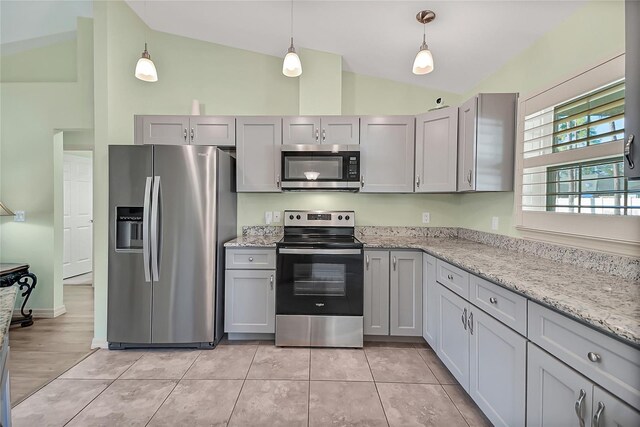 kitchen with gray cabinets, stainless steel appliances, and lofted ceiling