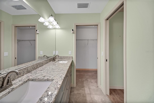 bathroom featuring tile patterned floors and vanity