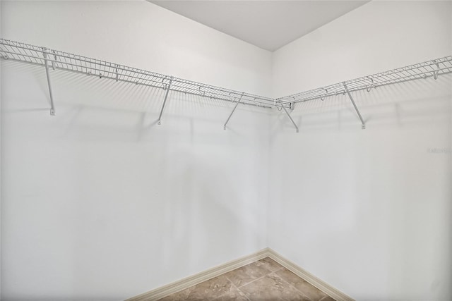 walk in closet featuring tile patterned floors