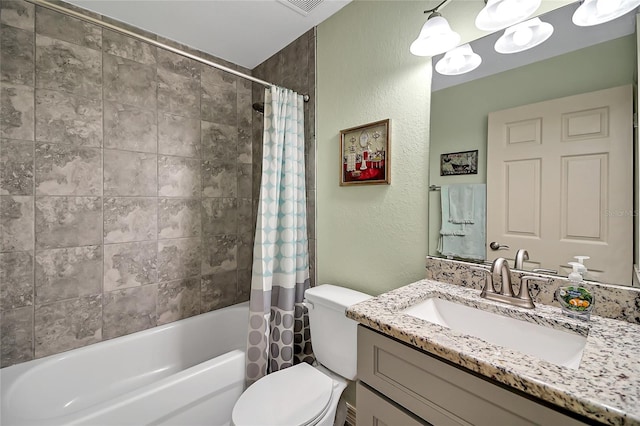 full bathroom featuring shower / bath combo with shower curtain, vanity, a notable chandelier, and toilet