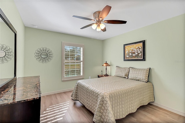 bedroom featuring ceiling fan and light hardwood / wood-style floors