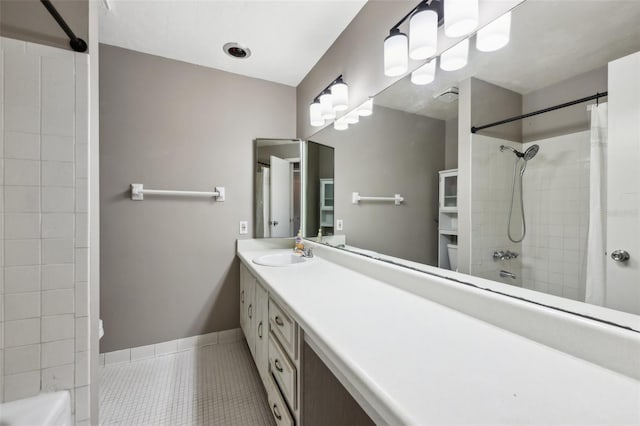 bathroom with tile patterned floors, vanity, and toilet