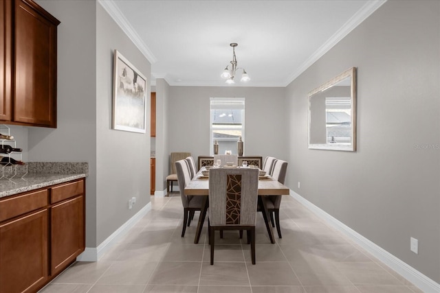 dining space featuring plenty of natural light, crown molding, and a notable chandelier