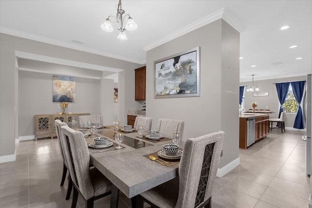 tiled dining room with ornamental molding and an inviting chandelier