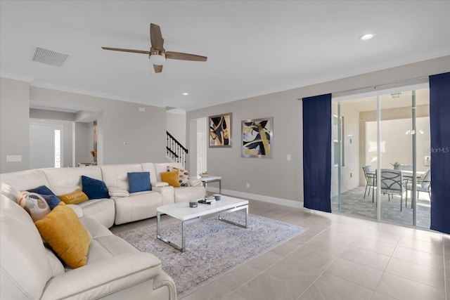 living room featuring ceiling fan, crown molding, light tile patterned floors, and plenty of natural light