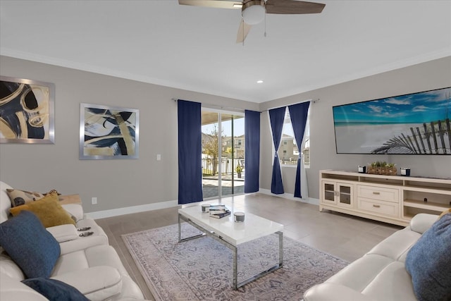 living room featuring ceiling fan and ornamental molding