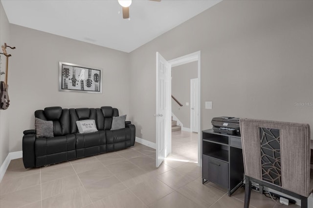 tiled living room with ceiling fan