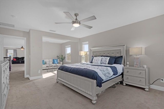 bedroom featuring light carpet and ceiling fan