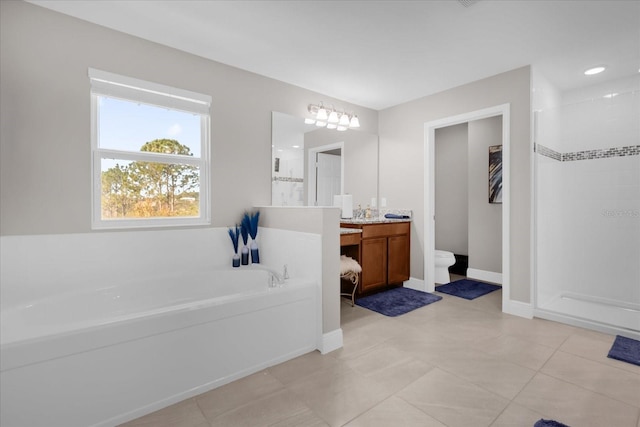 bathroom featuring tile patterned floors, vanity, and independent shower and bath