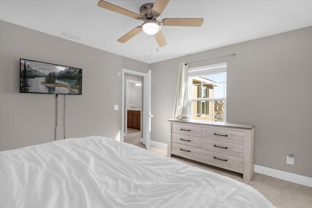 bedroom featuring ceiling fan and light colored carpet