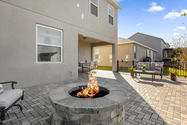 view of patio / terrace with a fire pit