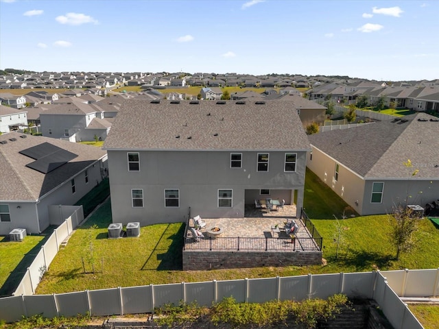 exterior space with outdoor lounge area, a lawn, a patio area, and central air condition unit