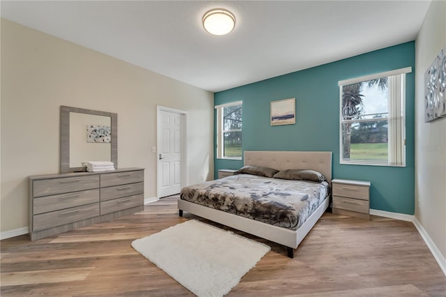 bedroom with light hardwood / wood-style flooring