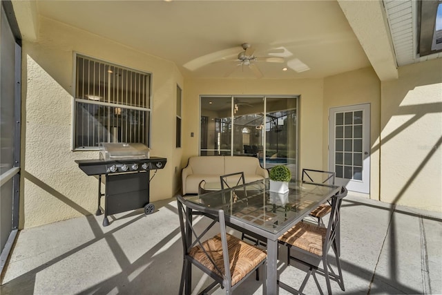 view of patio with grilling area and ceiling fan