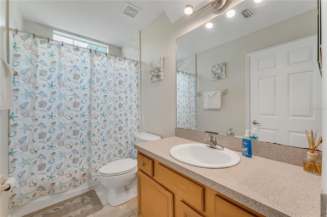 bathroom featuring tile patterned flooring, vanity, a shower with shower curtain, and toilet