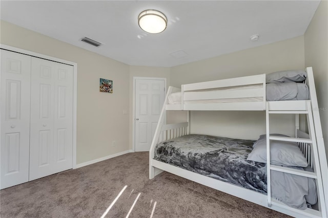 bedroom with a closet and carpet