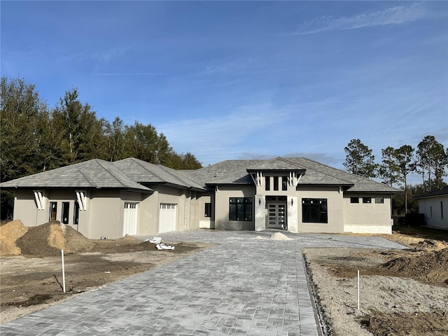 prairie-style home featuring a garage