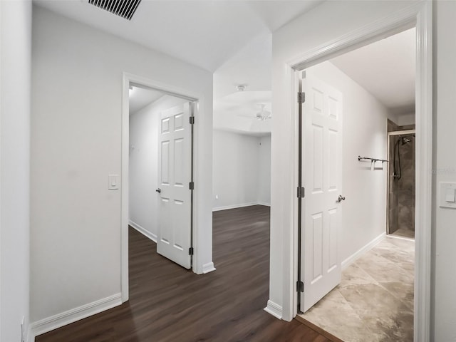 hall featuring dark wood-type flooring