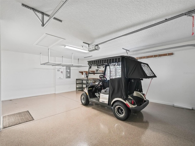 garage with electric panel and a garage door opener