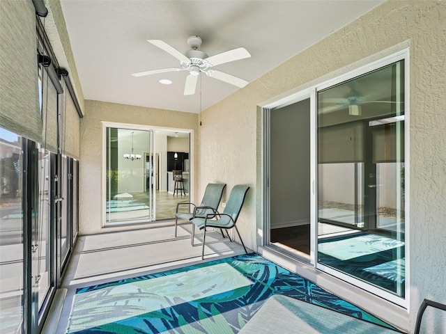 exterior space with ceiling fan