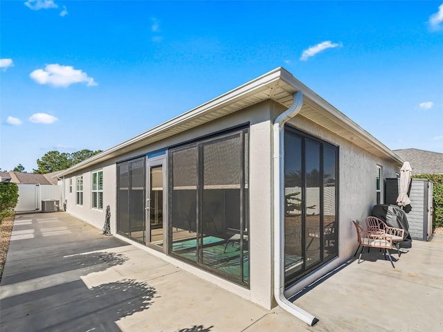 exterior space featuring central AC and a patio area