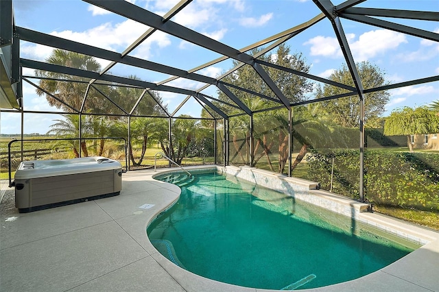 view of pool with a patio and a lanai