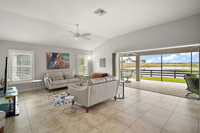 tiled living room with vaulted ceiling and ceiling fan