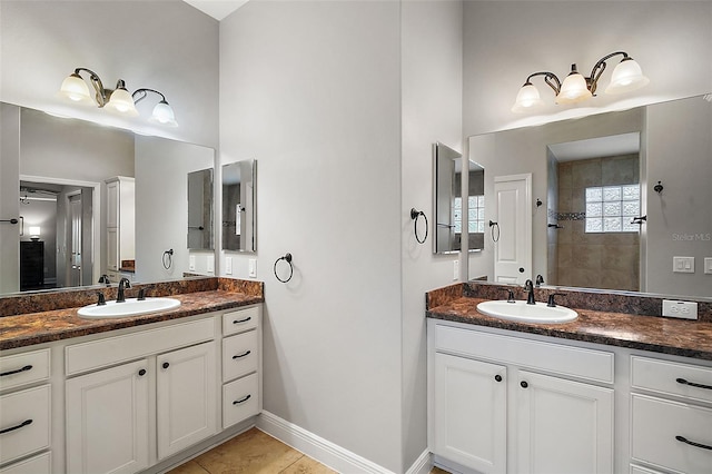 bathroom with tile patterned floors and vanity