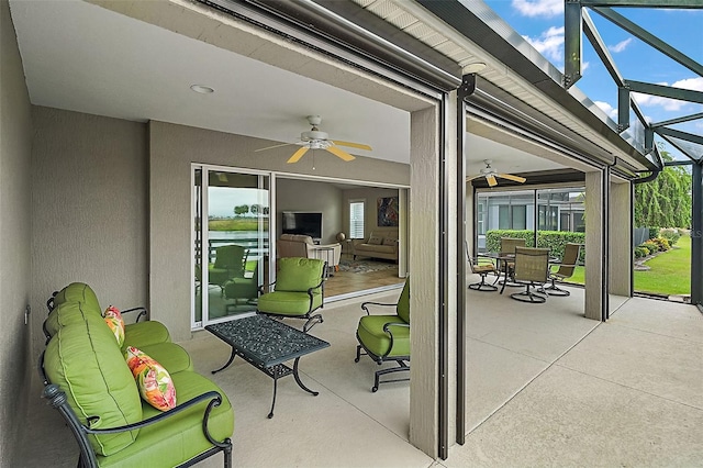 view of patio / terrace featuring a lanai