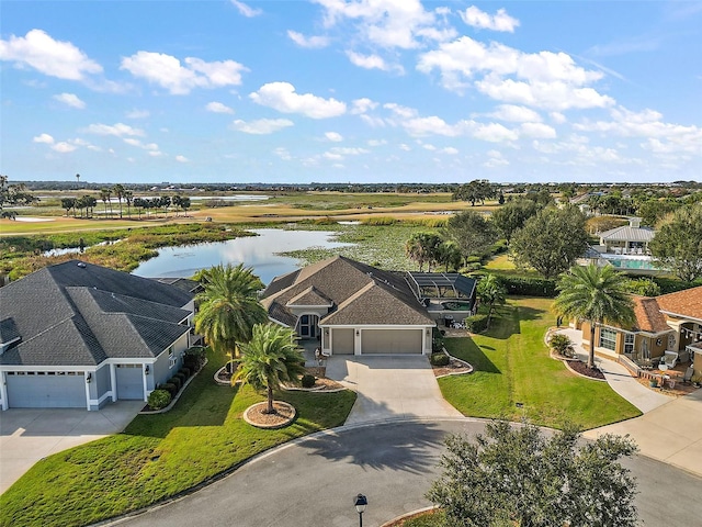 birds eye view of property with a water view