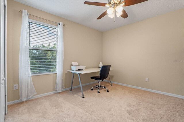 office featuring ceiling fan and light colored carpet