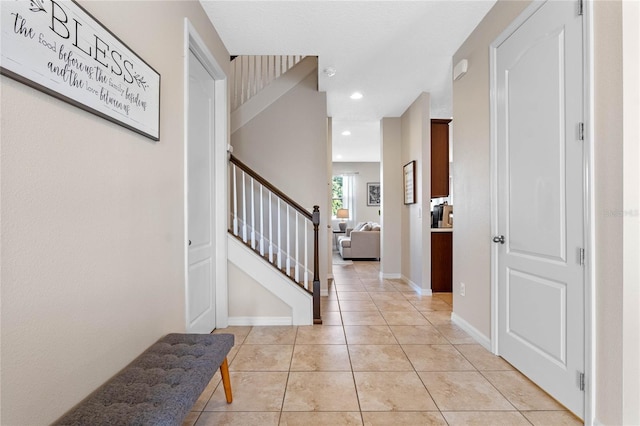 foyer entrance featuring light tile patterned floors