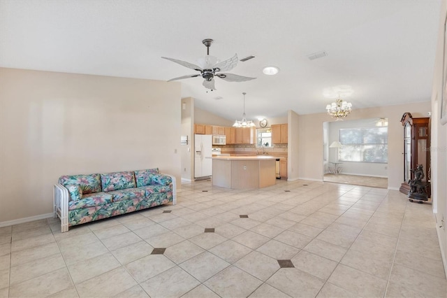 unfurnished living room featuring ceiling fan with notable chandelier, lofted ceiling, and light tile patterned flooring