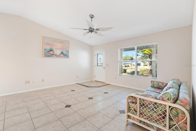 living room featuring light tile patterned floors, ceiling fan, and lofted ceiling