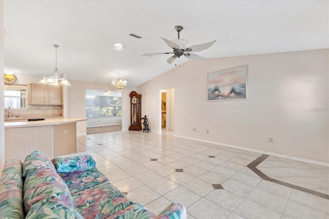 1201 De La Fuente Ct, The Villages, FL 32162 - living room with a chandelier, light tile patterned floors, baseboards, vaulted ceiling, and ceiling fan